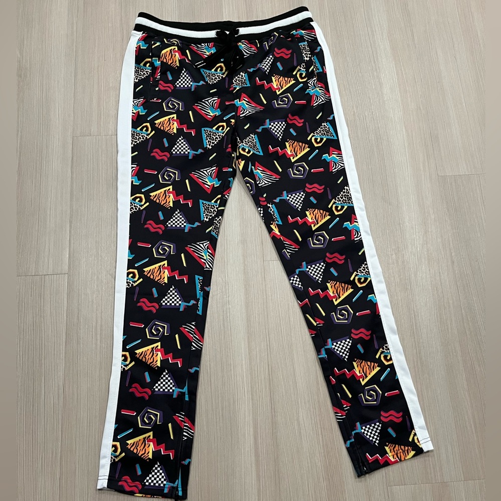80s 90s Track Pants with Zipper Bottoms and Geometric Print.